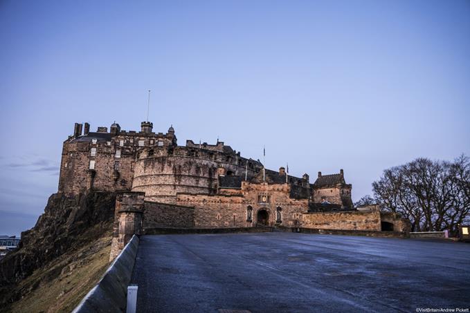  Edinburgh Castle at dusk. View of the histori building from the tattoo ground open space.