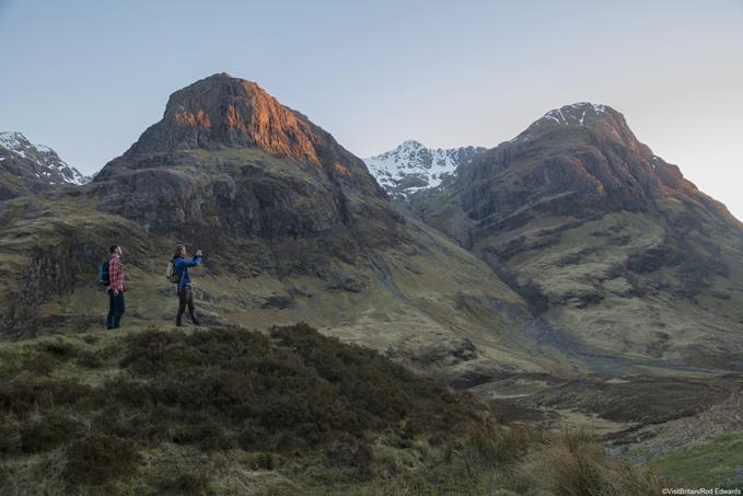 Two men hiking at Coire nan Lochan, a corrie of Bidean nam Bian, Glencoe, Scottish Highlands.