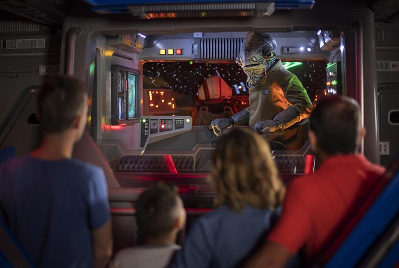 Lieutenant Bek, a Mon Calamari Resistance officer, speaks with guests aboard an Intersystem Transport Ship as they blast off Batuu in Star Wars: Rise of the Resistance, the groundbreaking new attraction opening Dec. 5, 2019, inside Star Wars: Galaxy’s Edge at Disney’s Hollywood Studios in Florida and Jan. 17, 2020, at Disneyland Park in California that takes guests into a climactic battle between the Resistance and the First Order. (Kent Phillips, photographer)