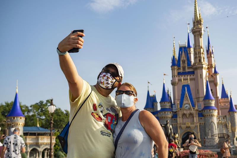 Guests stop to take a selfie at Magic Kingdom Park, July 11, 2020, at Walt Disney World Resort in Lake Buena Vista, Fla., on the first day of the theme park’s phased reopening. (Matt Stroshane, Photographer)