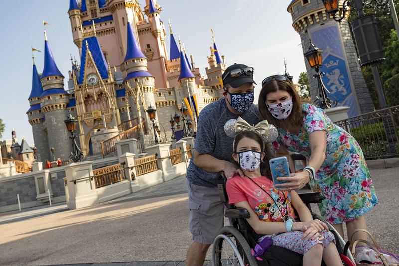 Guests take a selfie at Magic Kingdom Park, July 11, 2020, at Walt Disney World Resort in Lake Buena Vista, Fla., on the first day of the theme park’s phased reopening. (Matt Stroshane, photographer)