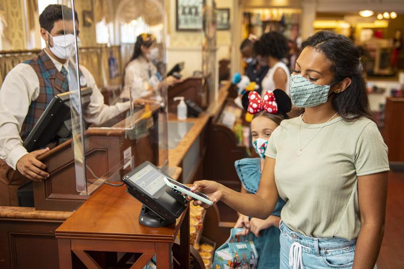 Guests at Walt Disney World Resort theme parks in Lake Buena Vista, Fla., are encouraged to use cashless payment options whenever possible when making purchases as the parks begin their phased reopening July 11, 2020. (David Roark, photographer)