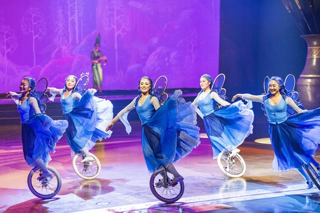 Five playful unicyclists representing the Blue Fairy from the classic Disney Animation film “Pinocchio” appear to effortlessly float across the stage during Drawn to Life, the highly anticipated new collaboration from Cirque du Soleil and Disney. The show premiered on Nov. 18, 2021, at Walt Disney World Resort in Lake Buena Vista, Fla. (Matt Stroshane, photographer).